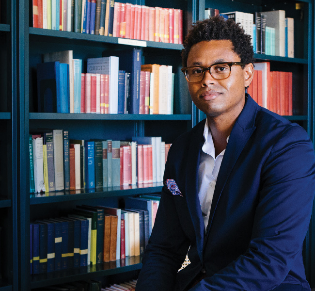 Educator at a bookcase