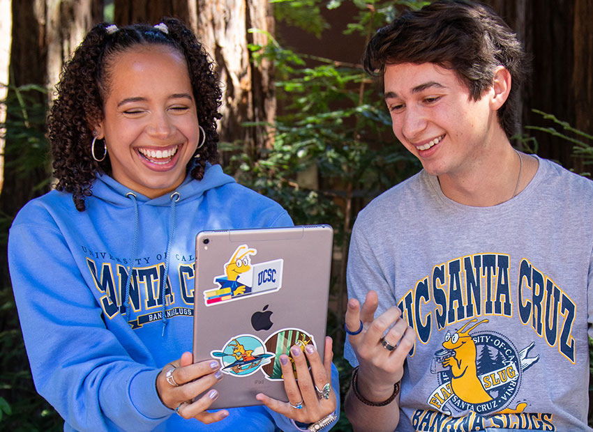 Two UC students smiling 