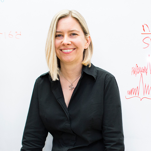 Teacher in front of whiteboard