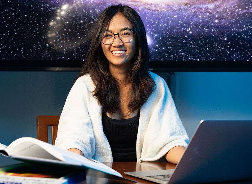 Student studying behind stars