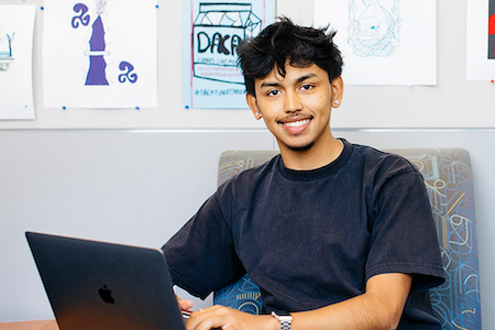 Photo of a student at a laptop